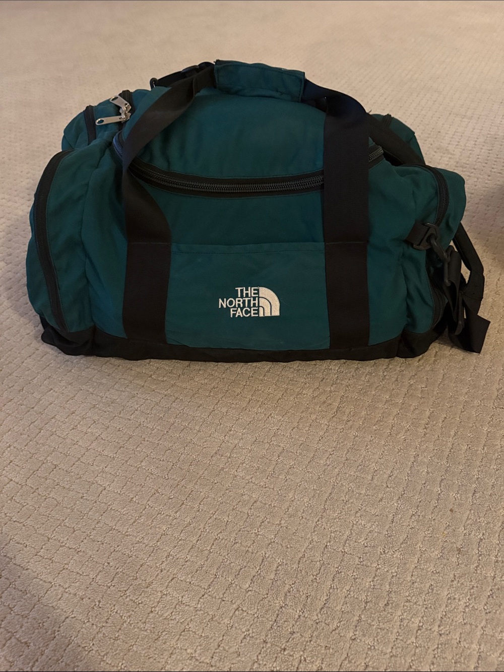 The North Face Green and Black Duffel Bag